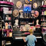 Commercial Construction Contractor shows Bandbox Piano played by child